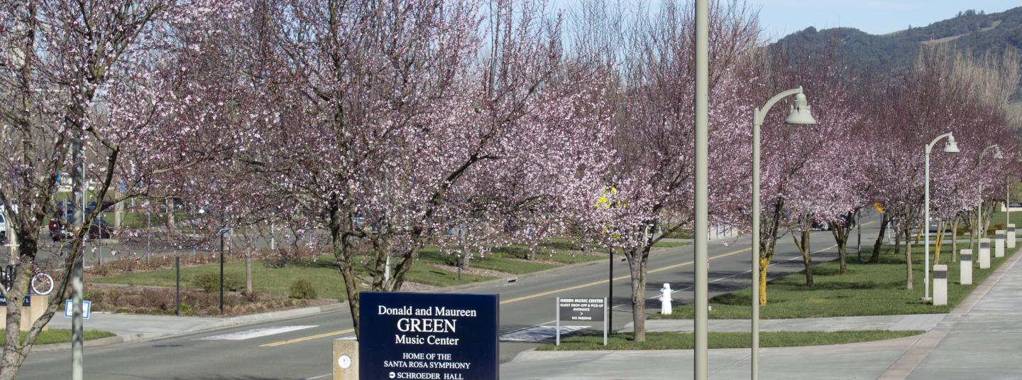 Green Music Center sign blooming trees